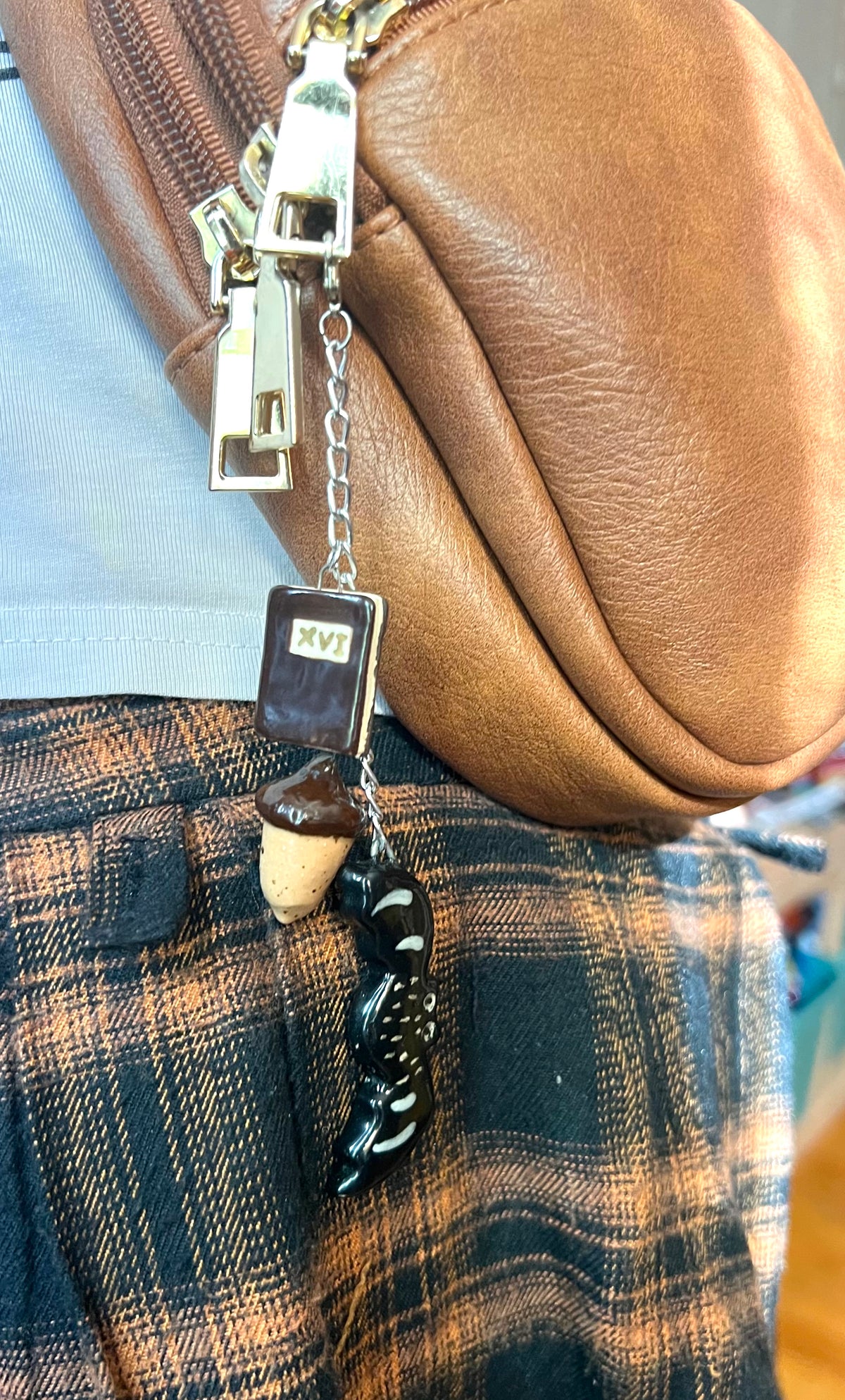 Autumn ceramic bag charm with book, bat, and acorn