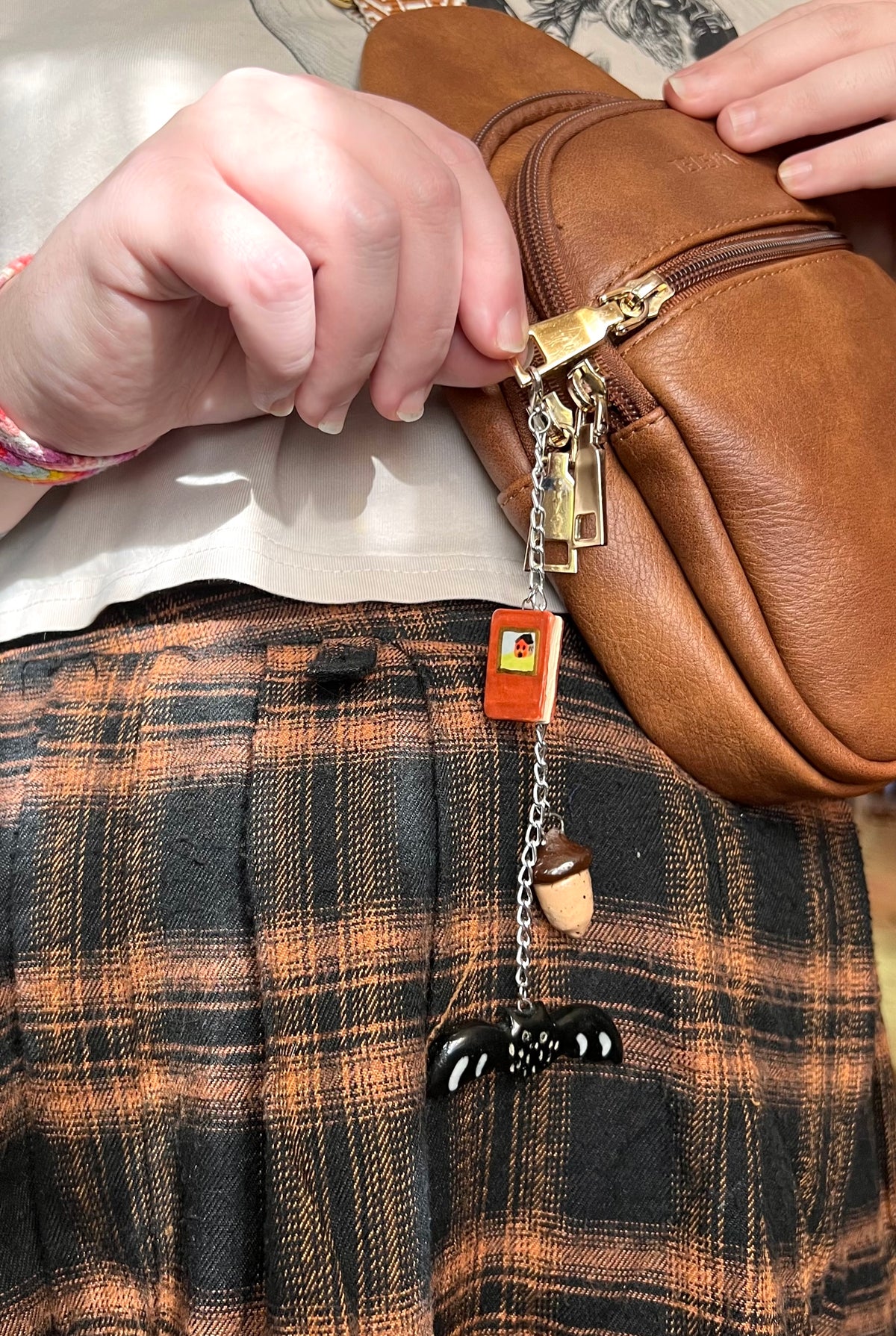 Autumn ceramic bag charm with book, bat, and acorn