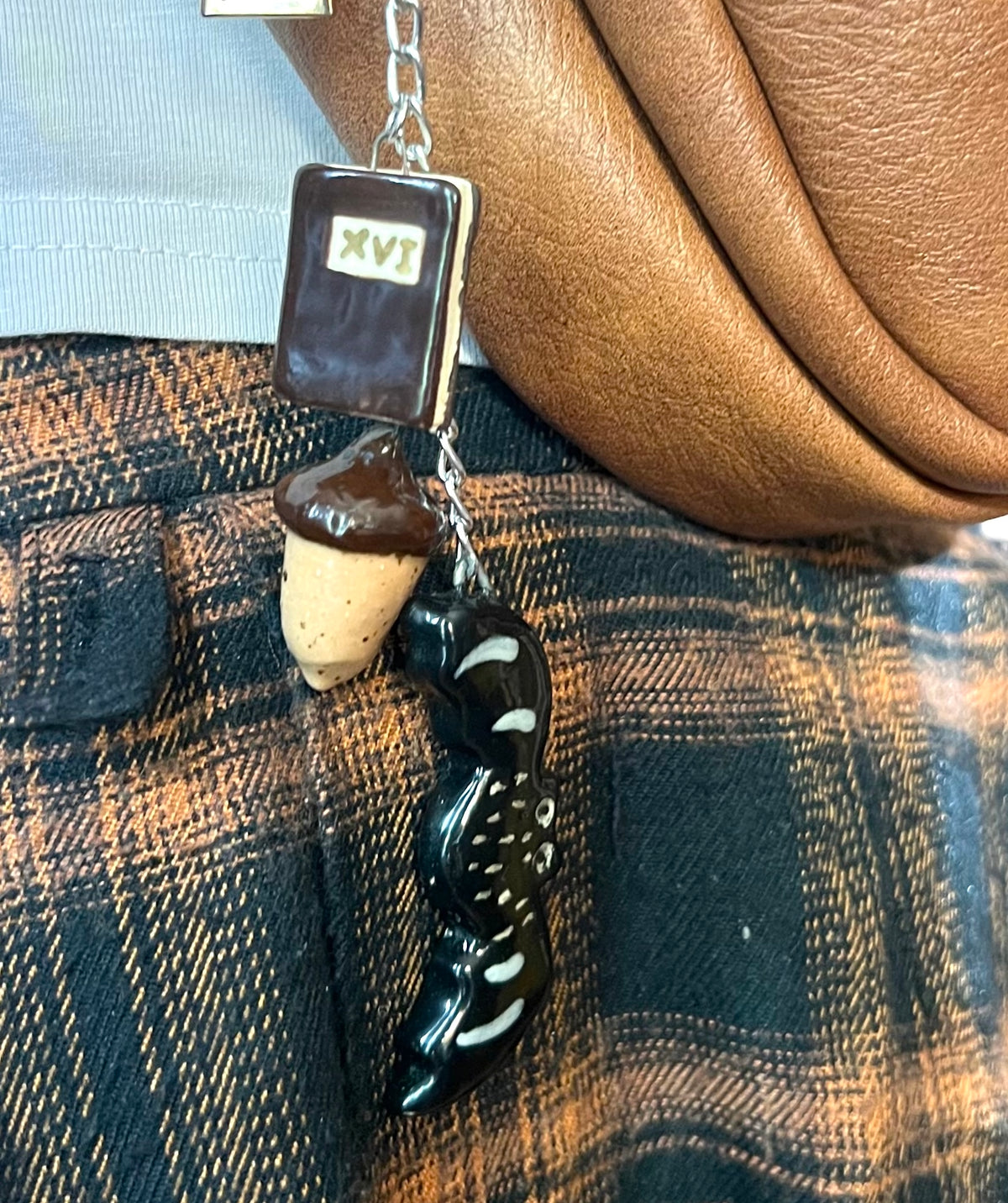 Autumn ceramic bag charm with book, bat, and acorn