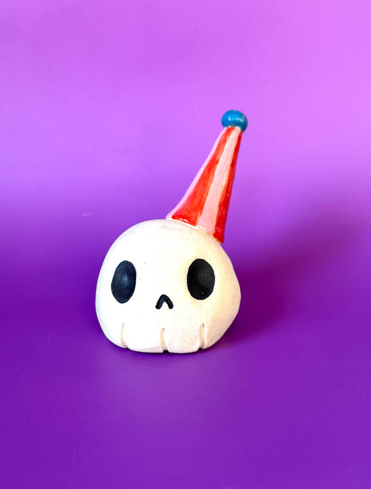 Party Skull! (Ceramic skull sculpture in a party hat)