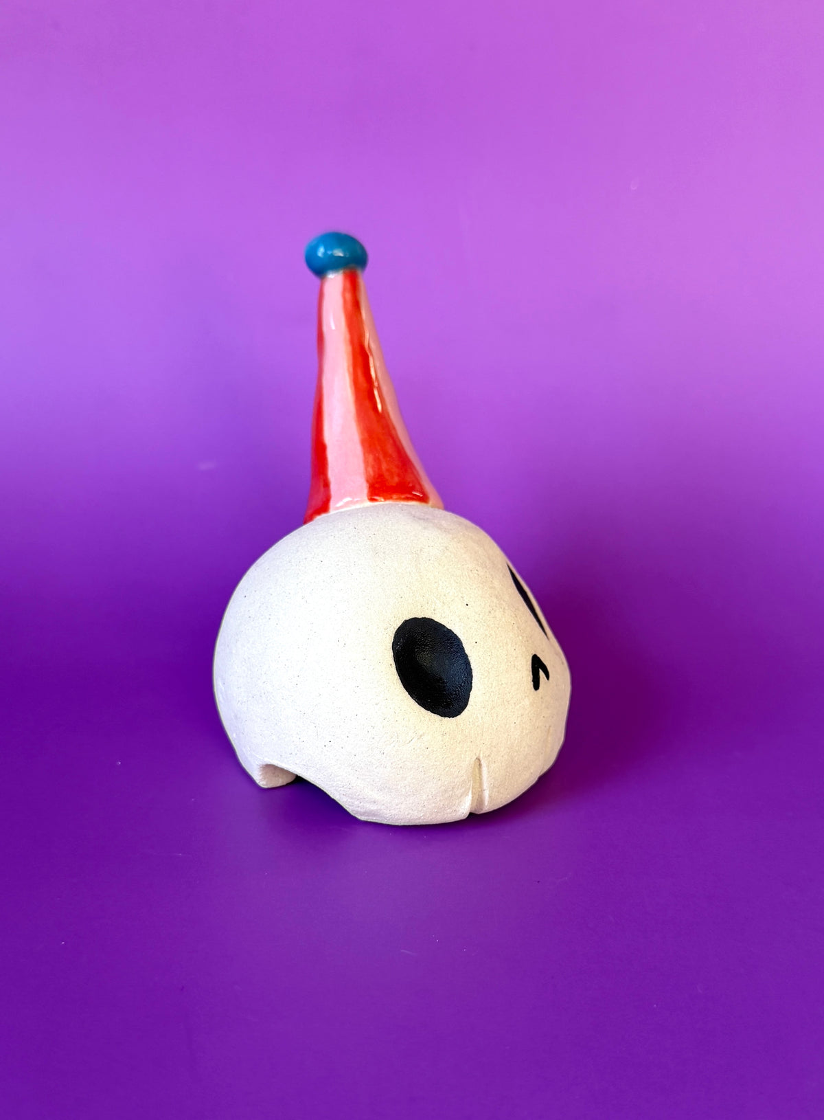 Party Skull! (Ceramic skull sculpture in a party hat)