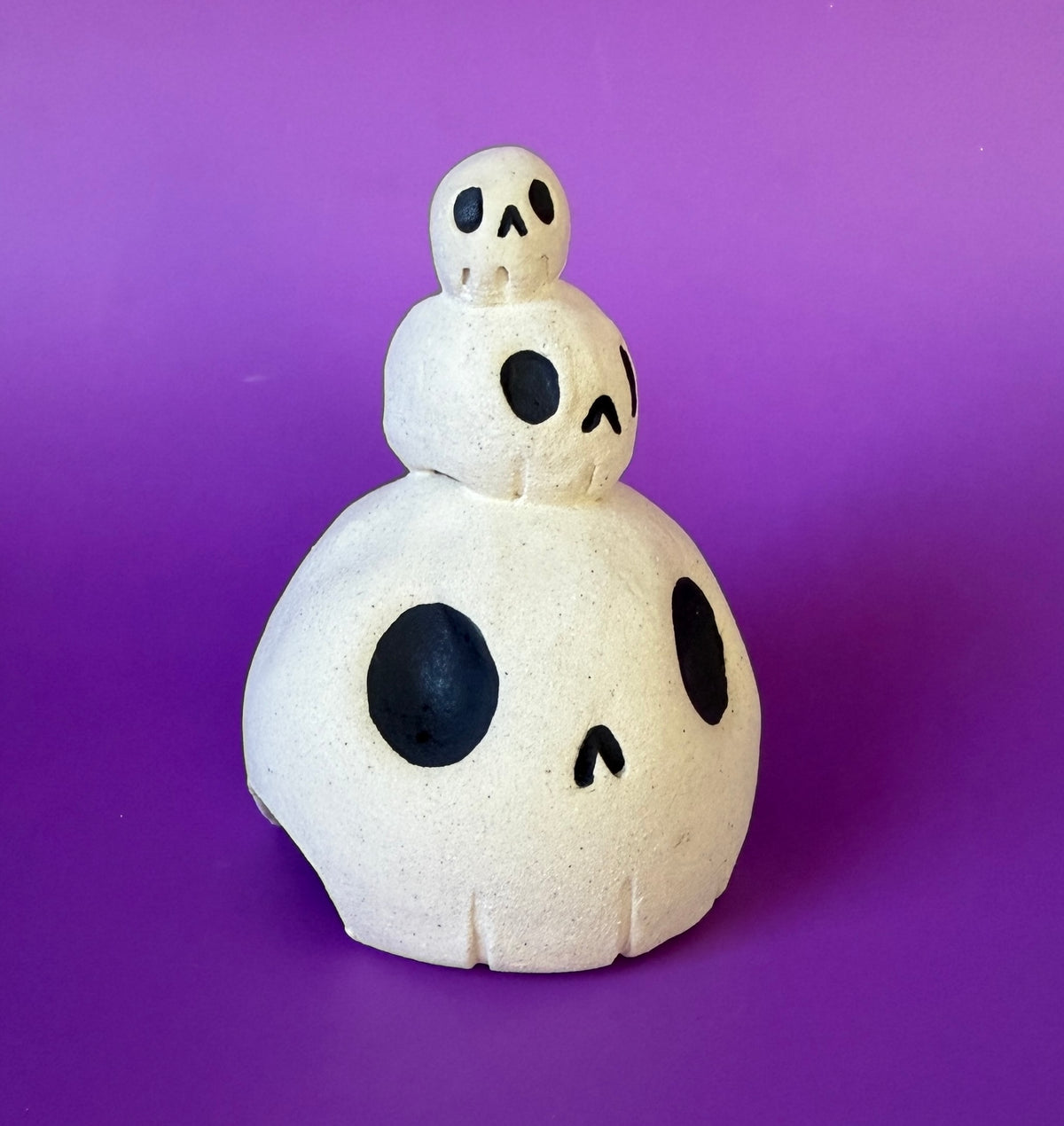 Three skulls stacked on top of each other ceramic bust