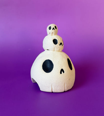 Three skulls stacked on top of each other ceramic bust