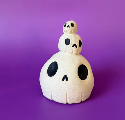 Three skulls stacked on top of each other ceramic bust